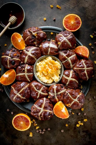 hot cross buns with orange slices and orange honey butter